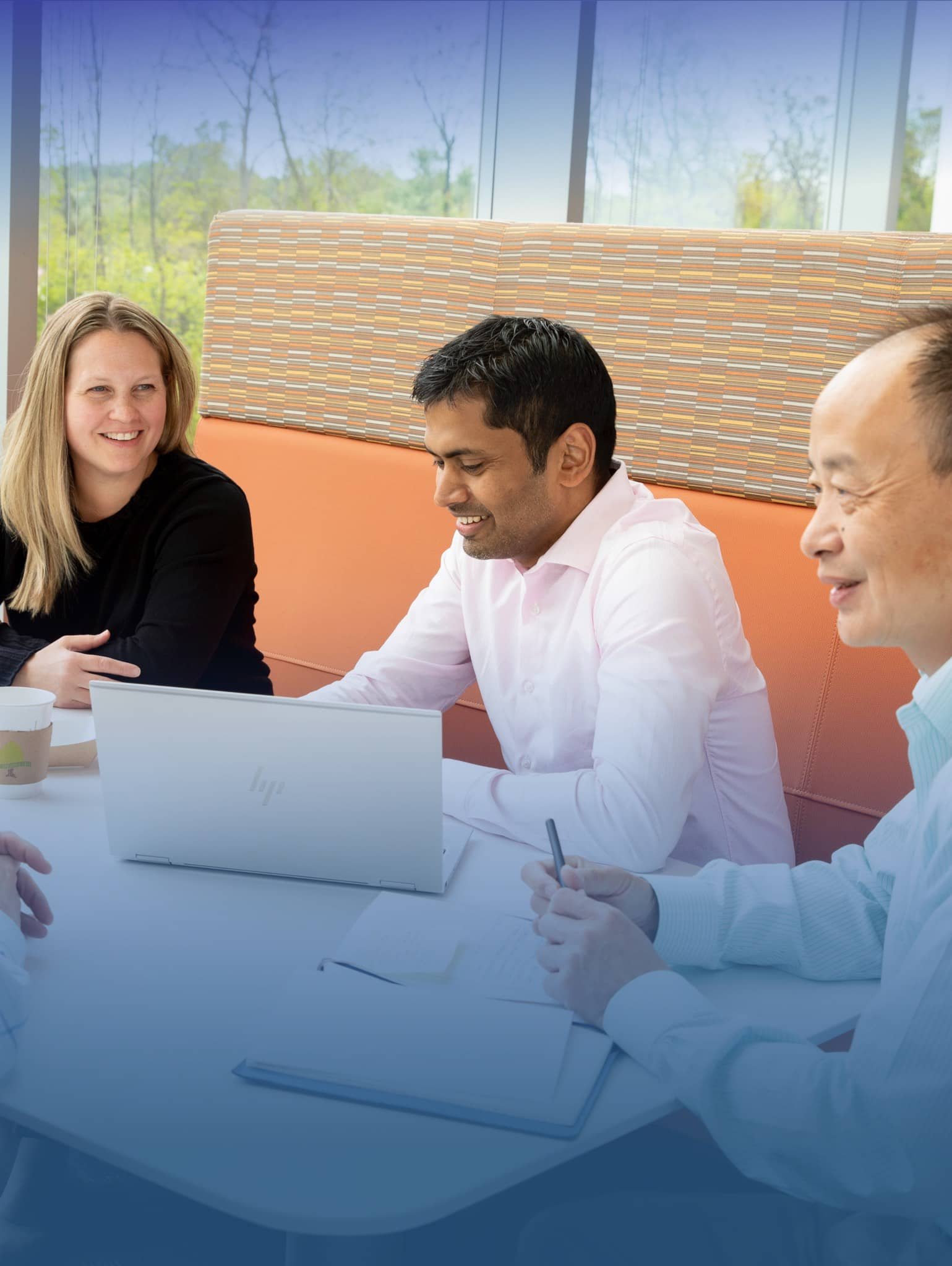 Diverse group of people sitting together and laughing